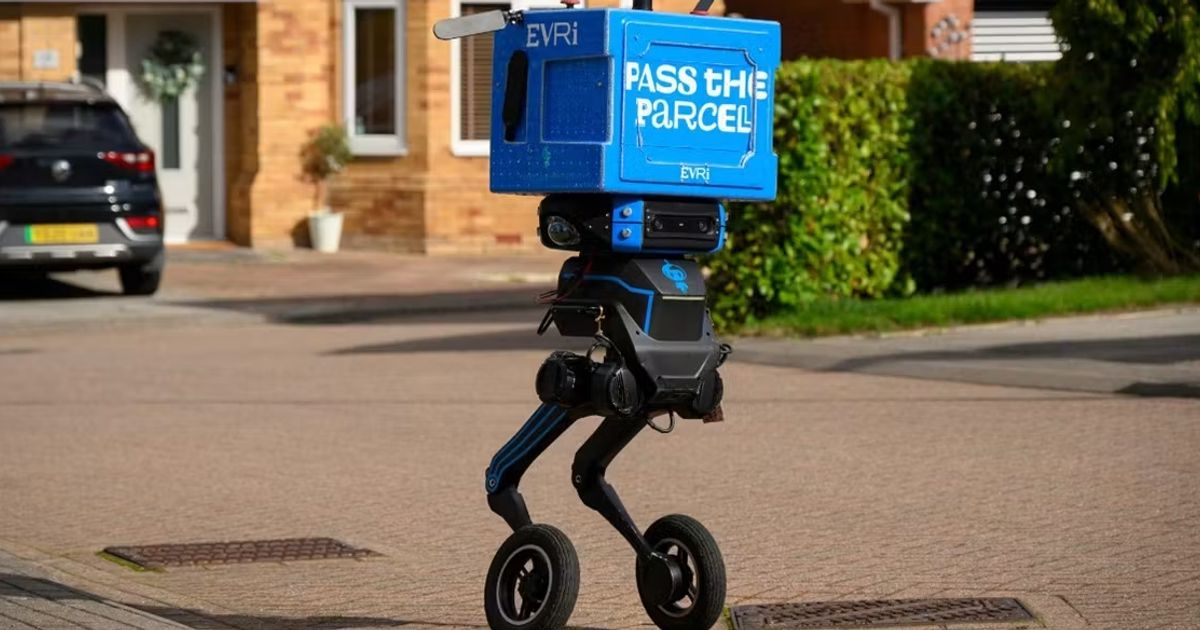 The Refined Robotics Iris delivery robot, a two-legged machine with an Evri-blue parcel crate for a torso, standing on a residential street