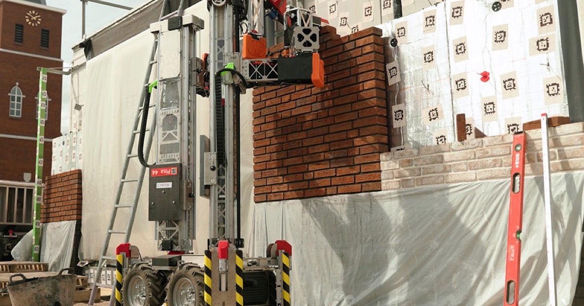 Monumental's Pisa bricklaying robot laying bricks on a residential construction site.