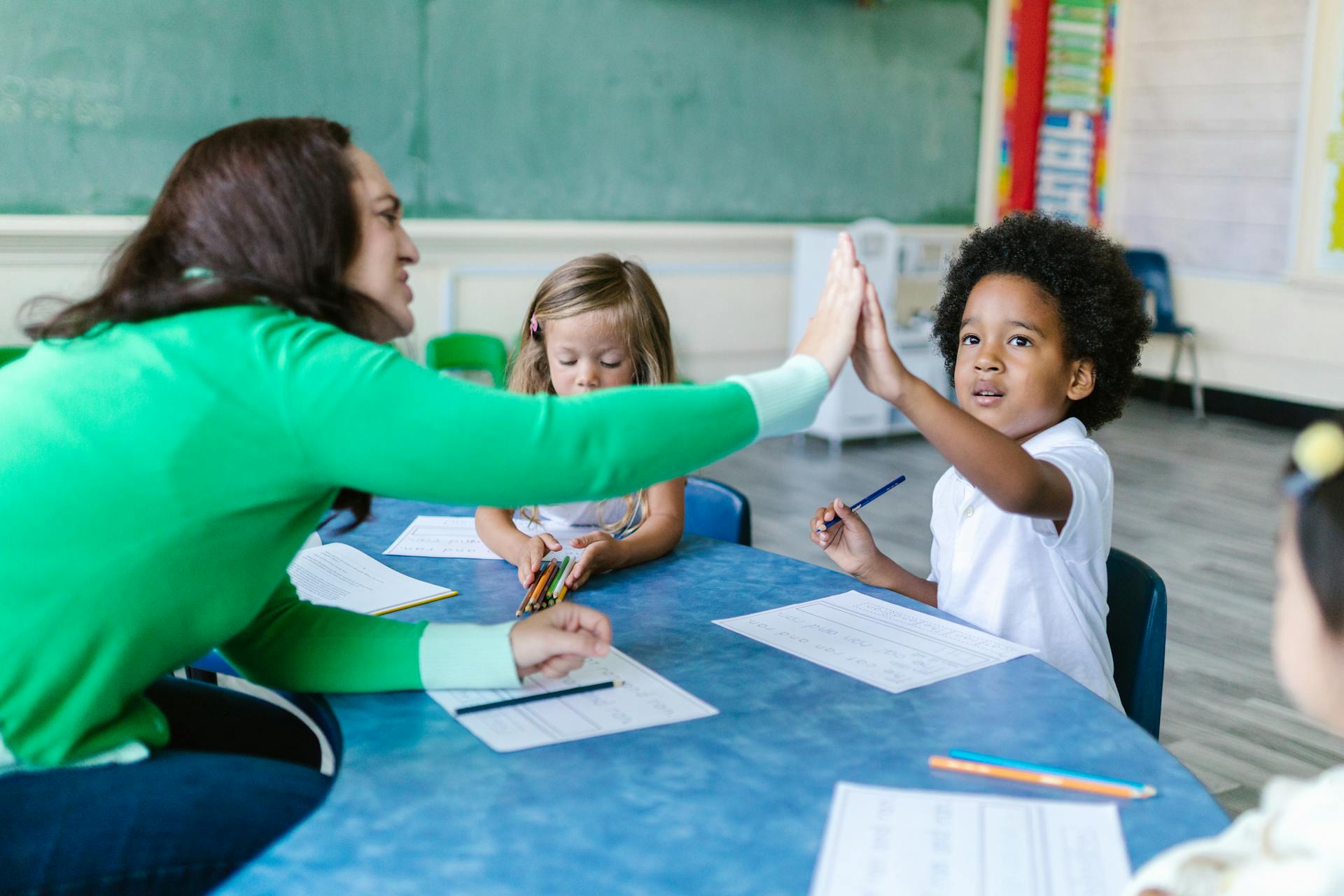 Teacher working with students in classroom