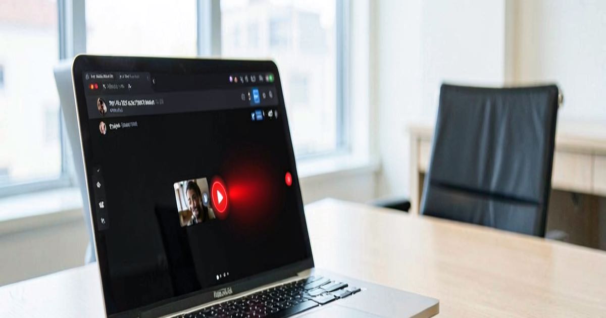 A bright office conference room with a laptop showing a video call interface, a red warning indicator on screen, warm afternoon light.