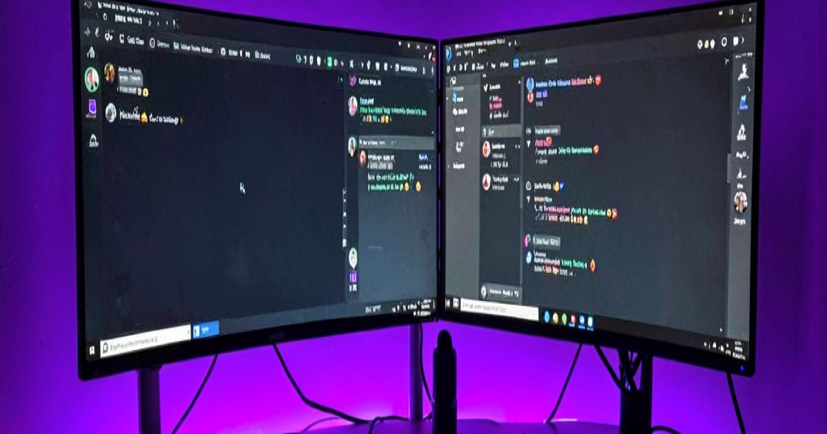 A glowing purple streaming setup with a webcam, microphone, and dual monitors showing a privacy settings panel with a toggled switch, warm lighting